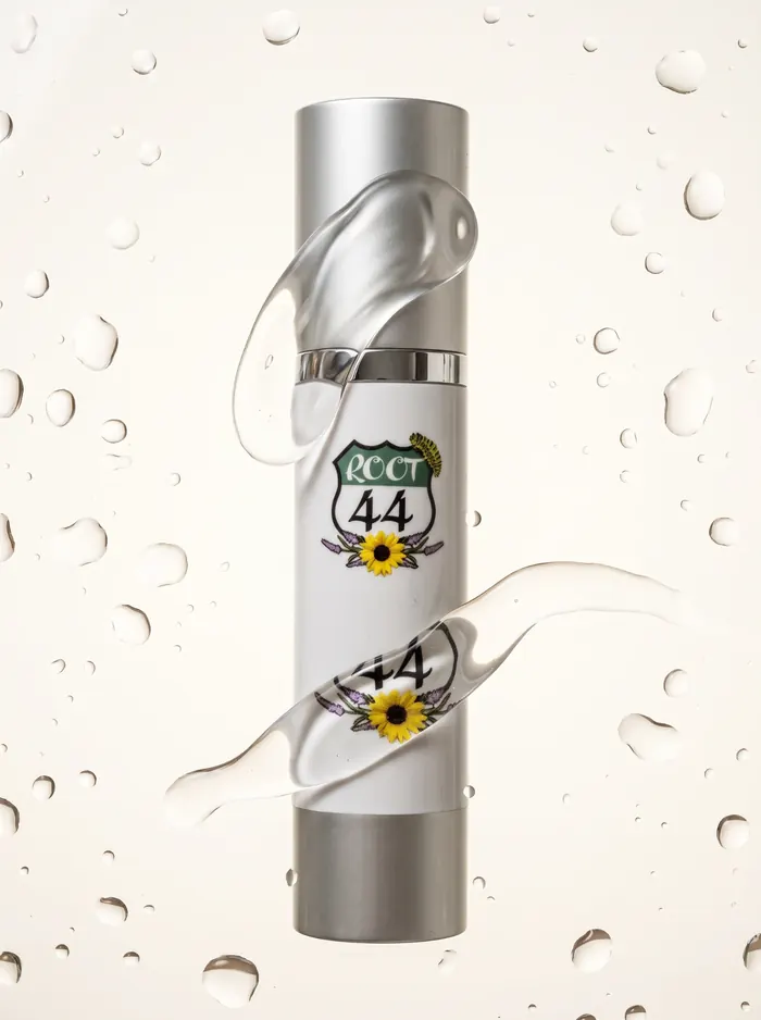 Root 44 Hyaluronic Serum bottle with clear swirls and droplets